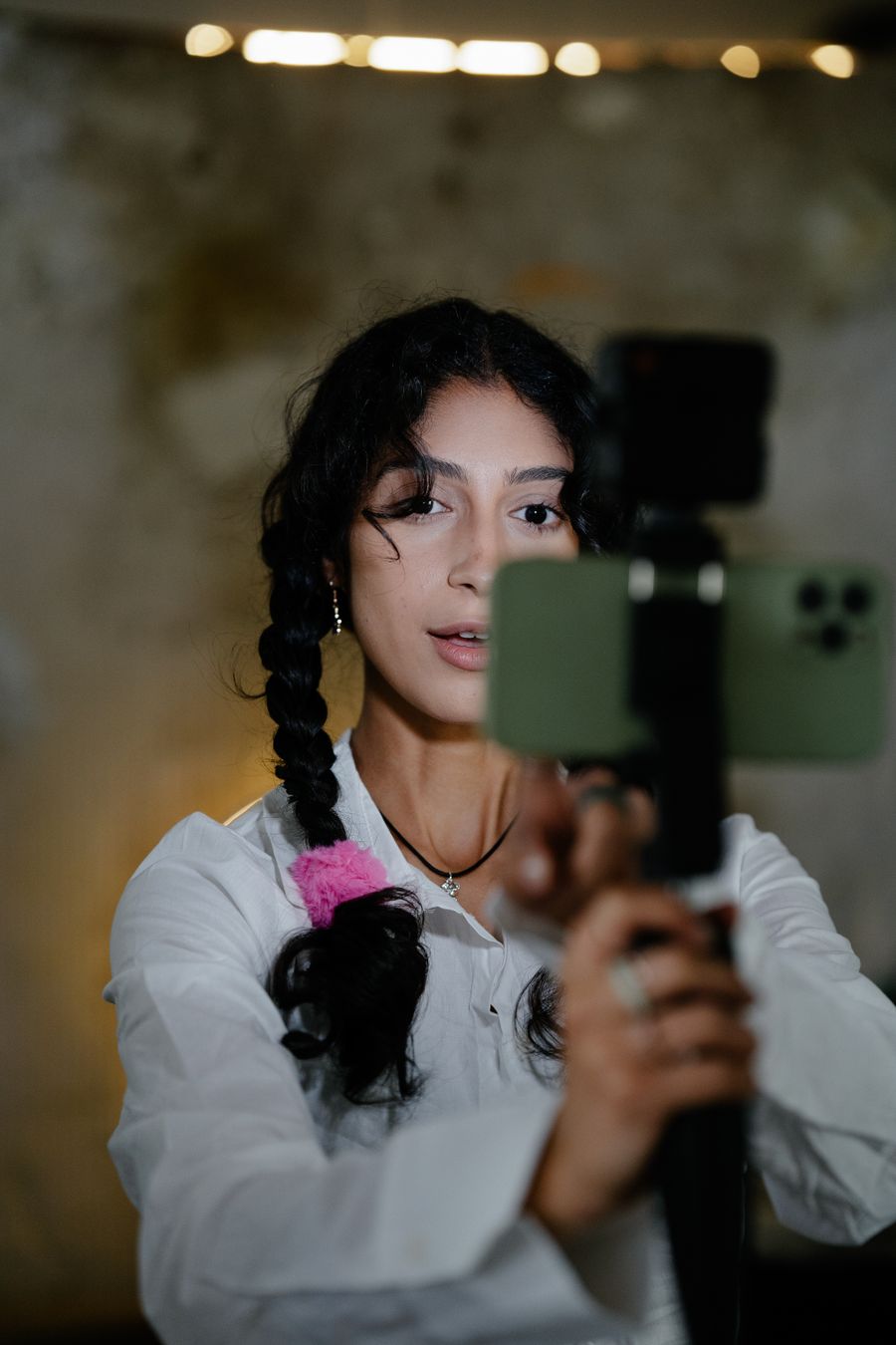 Creator filming with a smartphone stabilizer