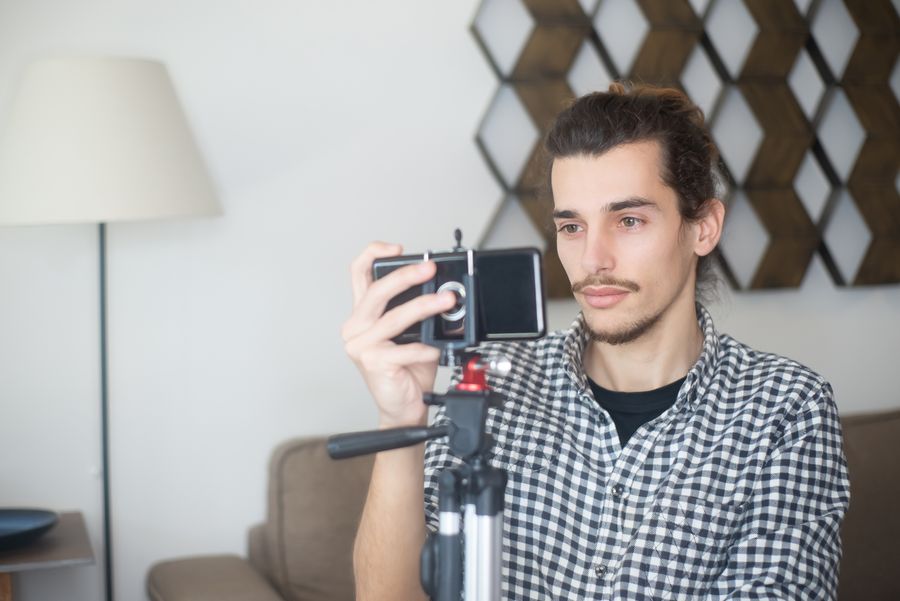 Creator filming content with a smartphone on a tripod